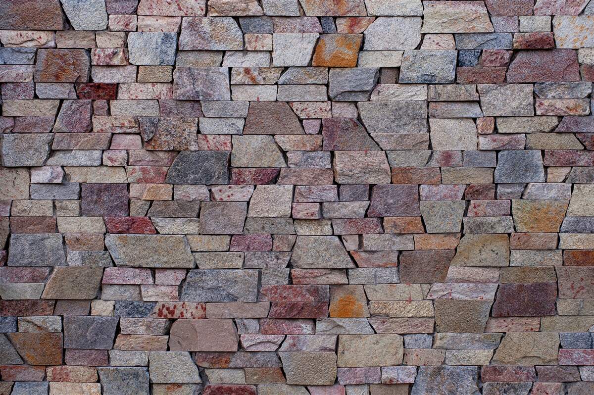 Papier peint construction de murs en pierre en milieu rural