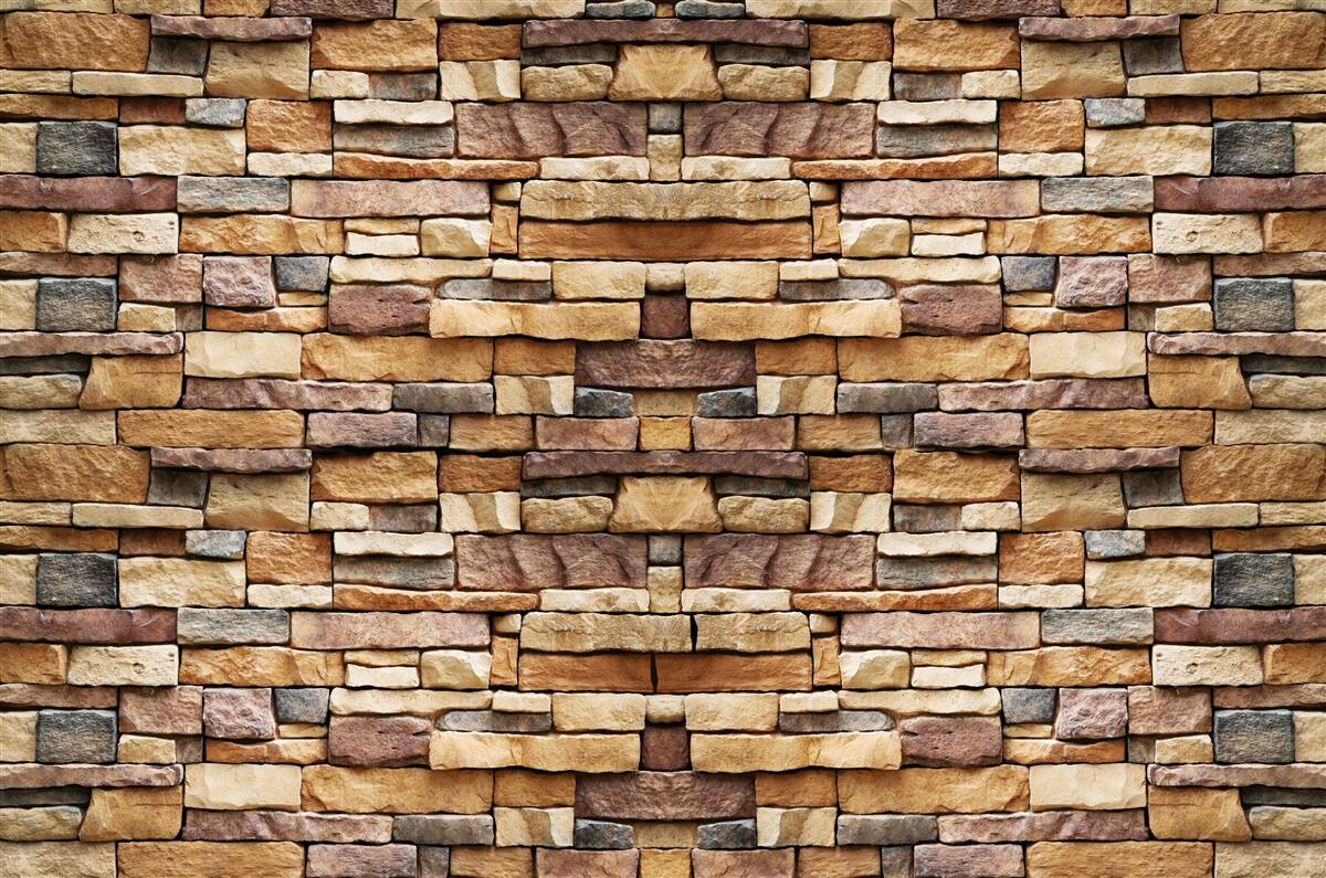 Papier peint Un mur composé de pierres multicolores