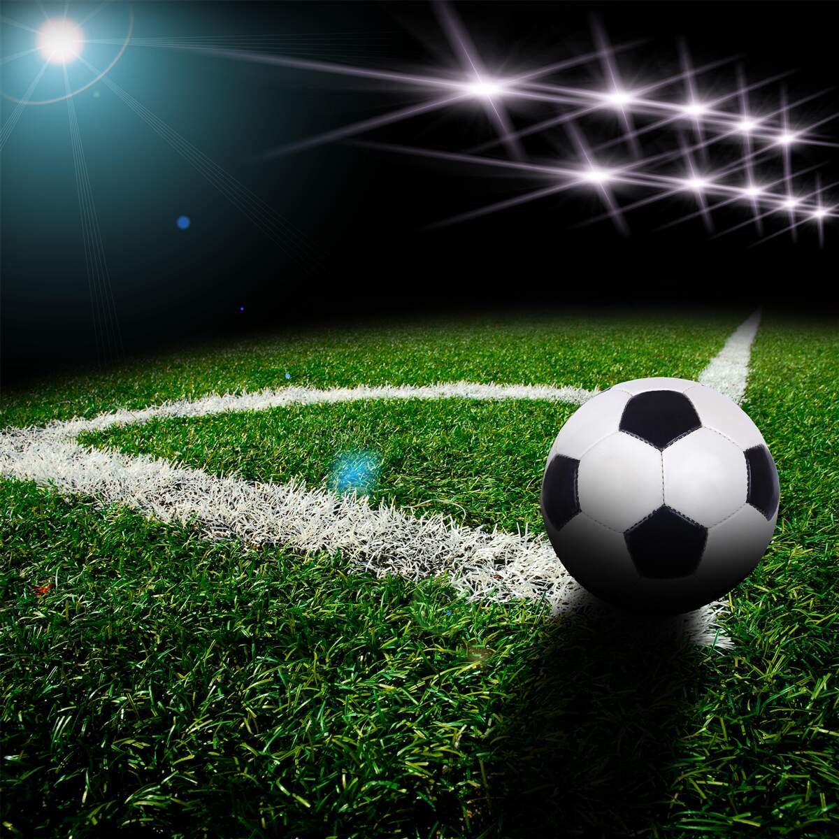 Papier peint le ballon repose sur la pelouse du stade