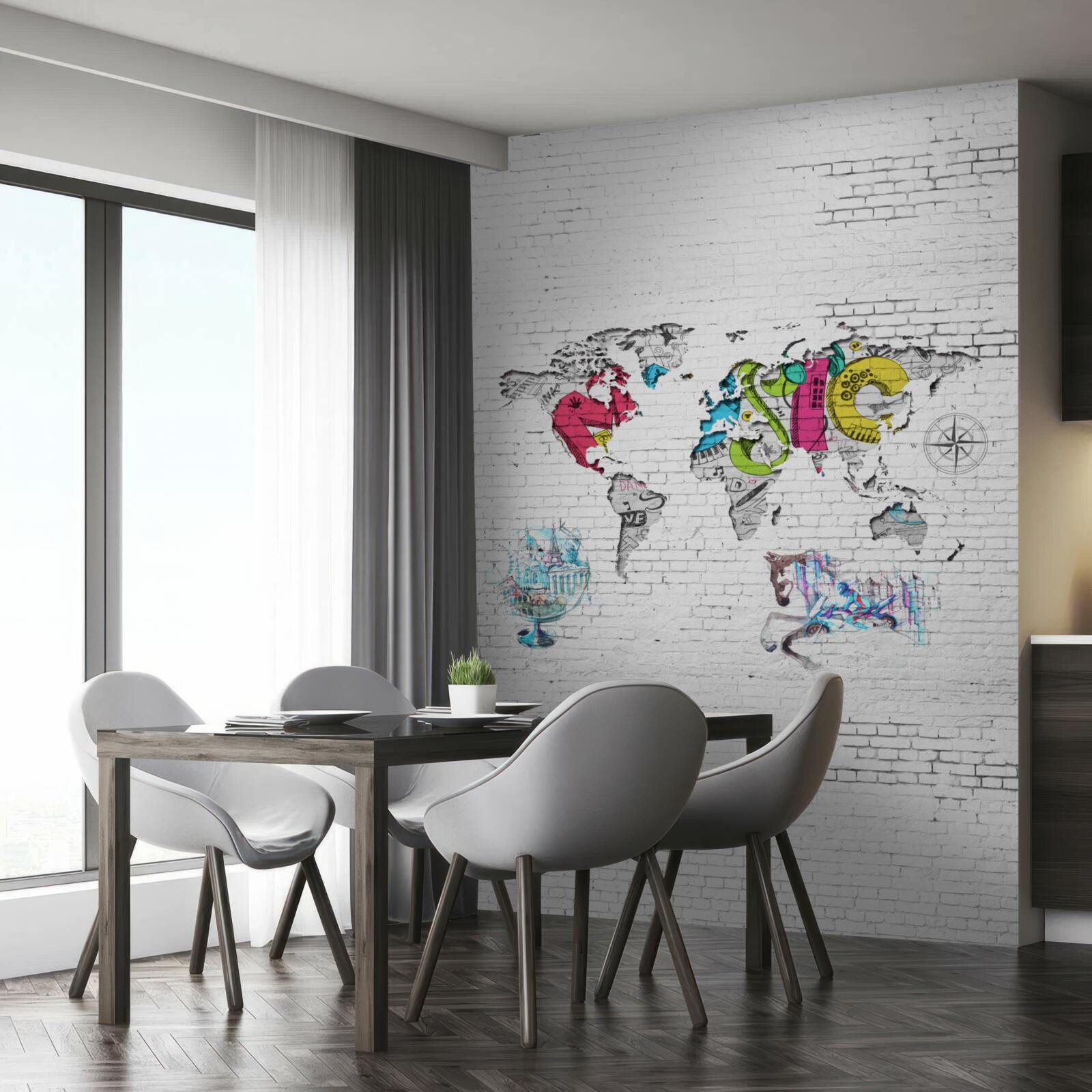 Papier peint carte du monde en différentes couleurs sur un mur blanc